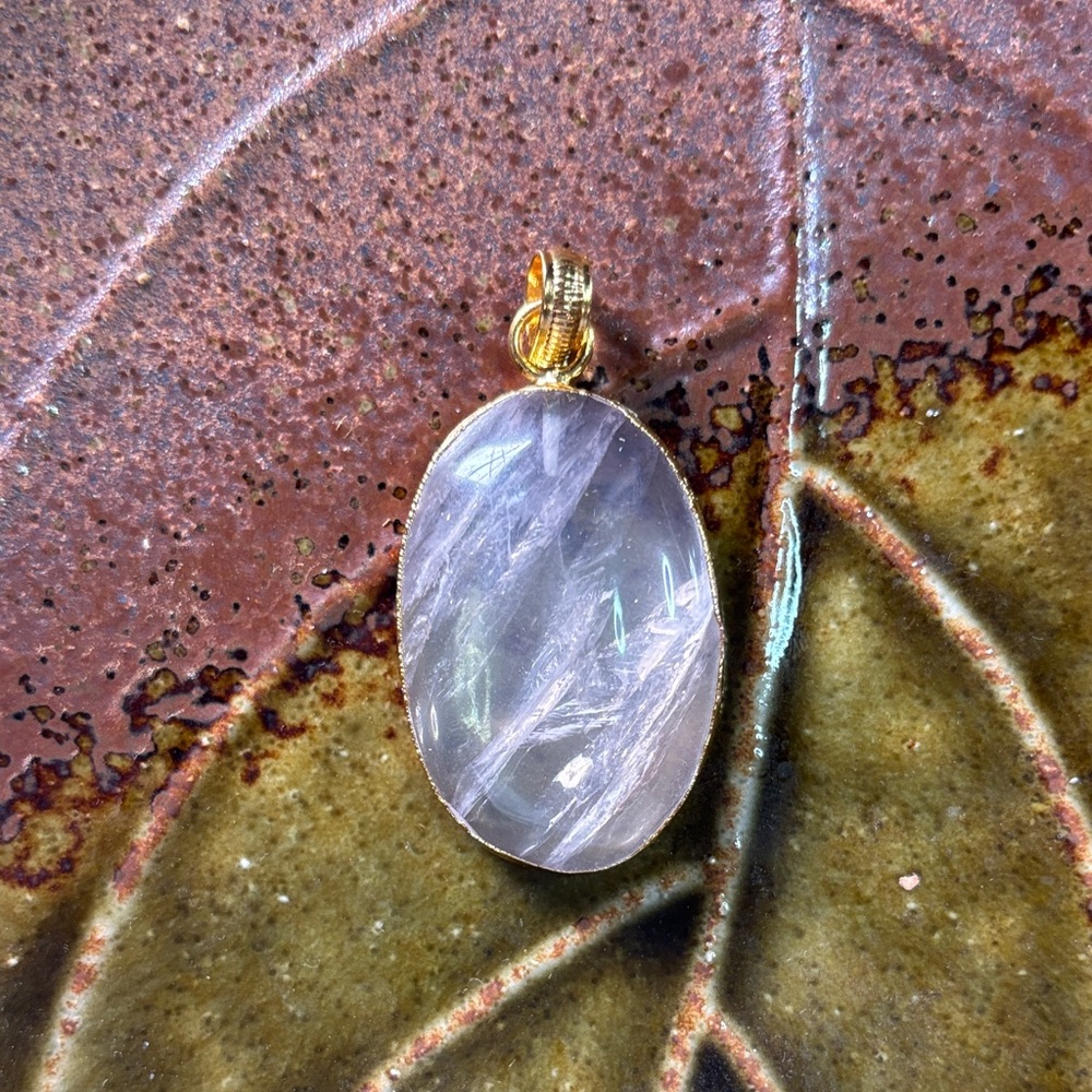 Gold-Trim Oval Quartz Crystal Gemstone Pendant